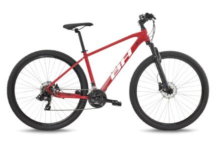 VTT BH Spike 1.0 rouge en situation sur un chemin de terre.