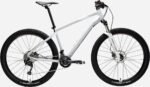 VTT Rockrider ST 540 S en extérieur sur un chemin forestier.